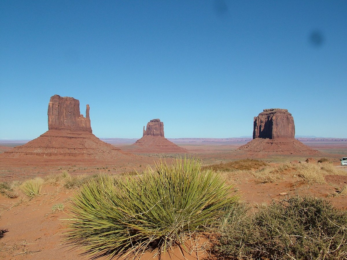 Red rock buttes rising from the desert floor in Monument Valley